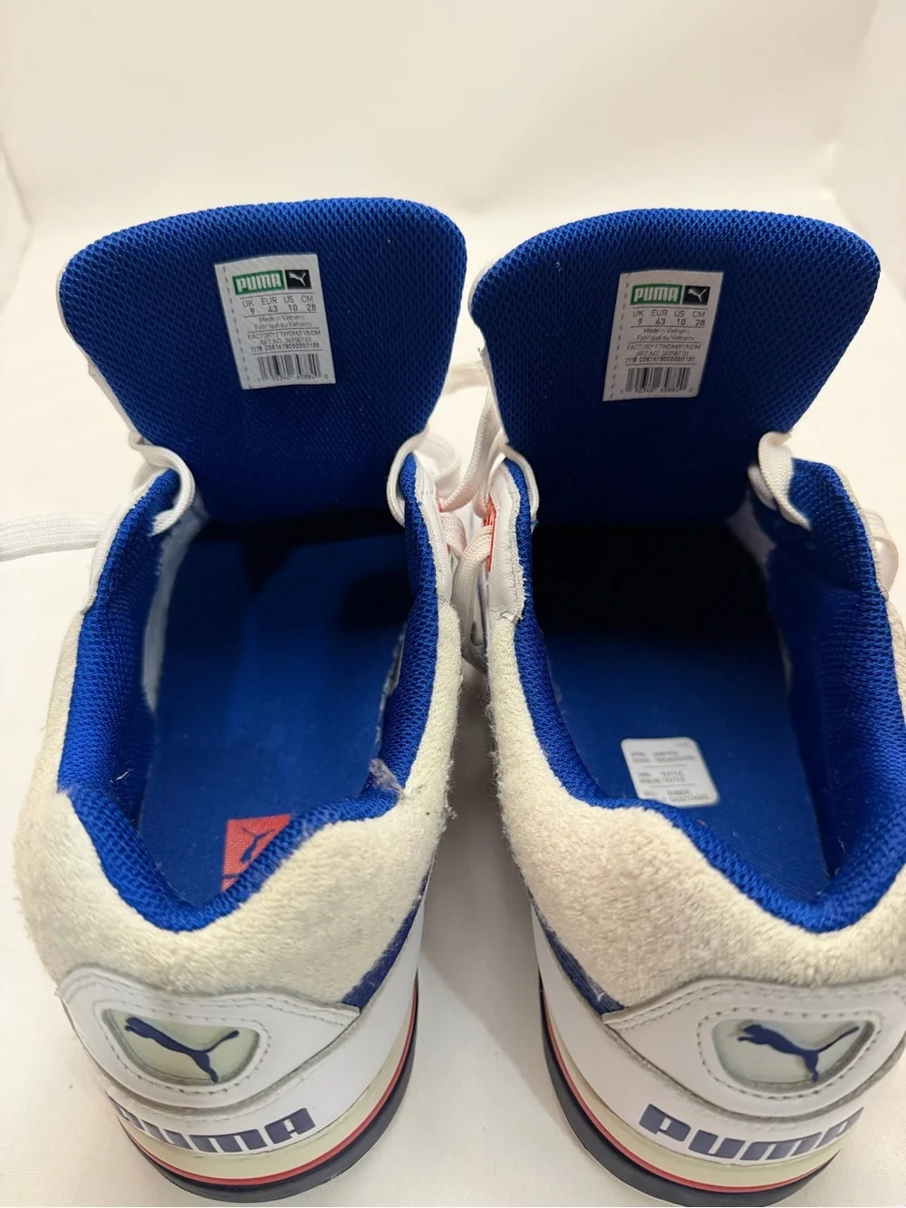 Puma White Athletic Sneakers with Blue and Red Accents